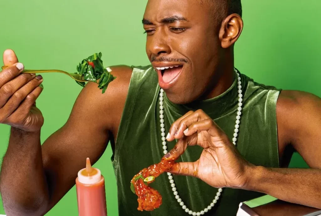 Person eating leafy greens joyfully